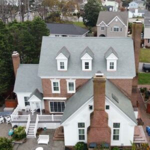 roof replacement white house with brick chimney