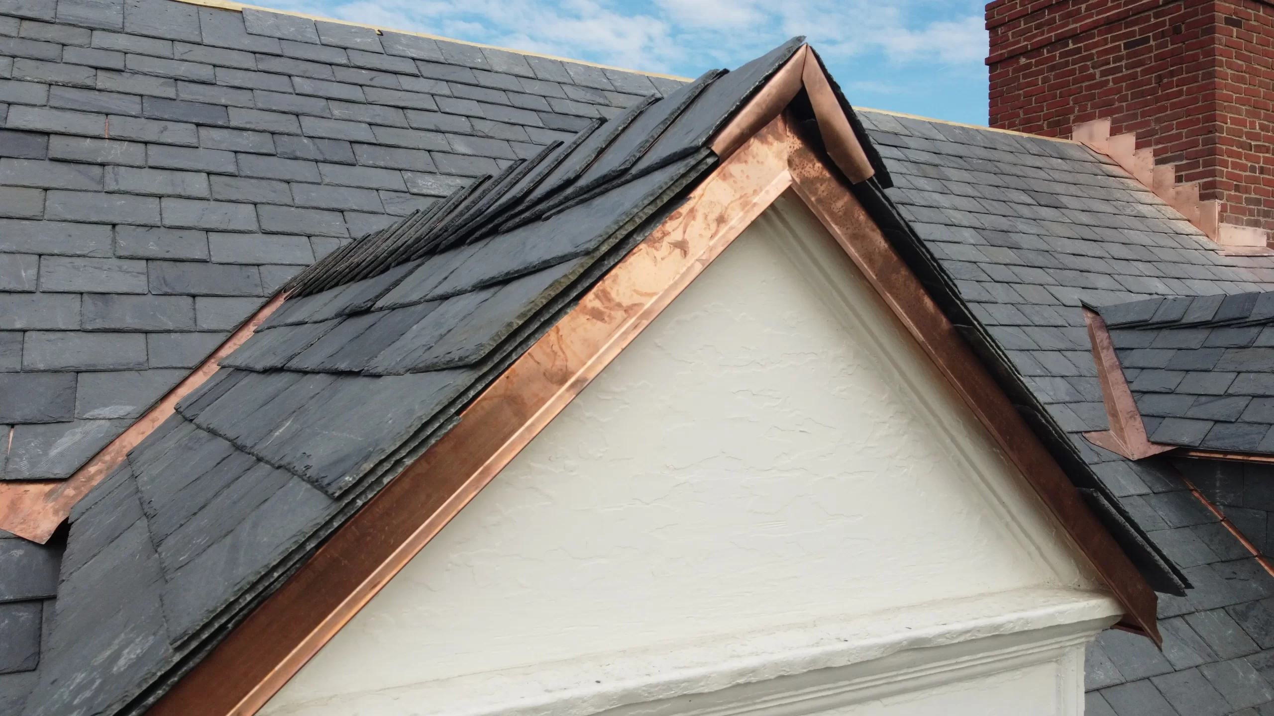 Slate roofing with copper trim